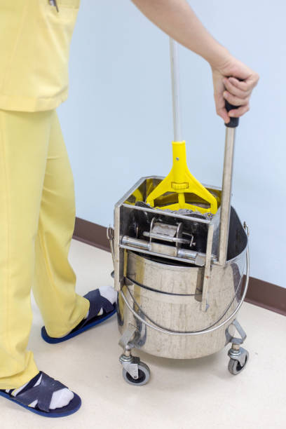 istock a professional cleaner washing floor with mopping 1302788188