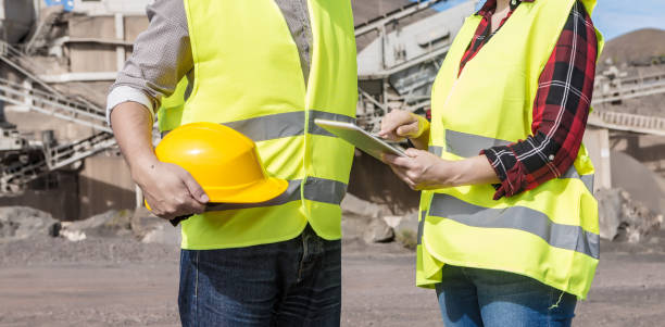 istock Engineers with tablet having meeting on industrial facility 1302789137