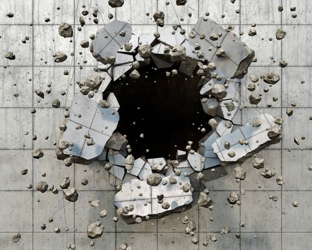 istock A hole in the wall with flying pieces, big and small, 3d illustration 1302790579