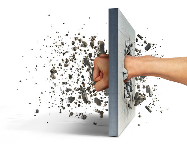 istock Fist hits the concrete wall, which shatters into many pieces, 3d illustration 1302790672