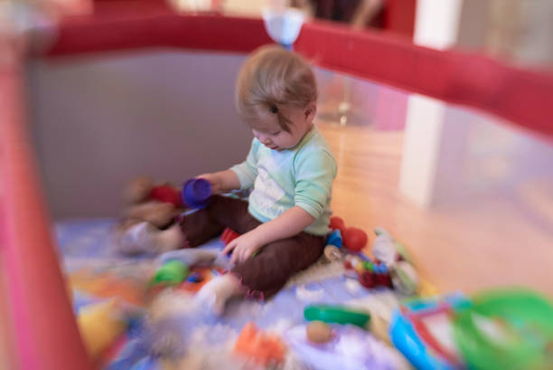 istock cute little baby playing in mobile bed 1302791896