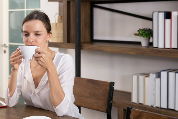 istock Female drinking coffee with smiles while enjoying her leisure time. 1302792140