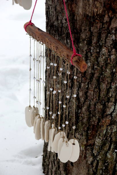 istock Hand made wind chimes hanging on a string with depth of field effect 1302794165