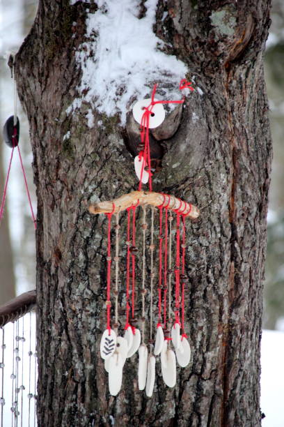 istock Hand made wind chimes hanging on a string with depth of field effect 1302794244