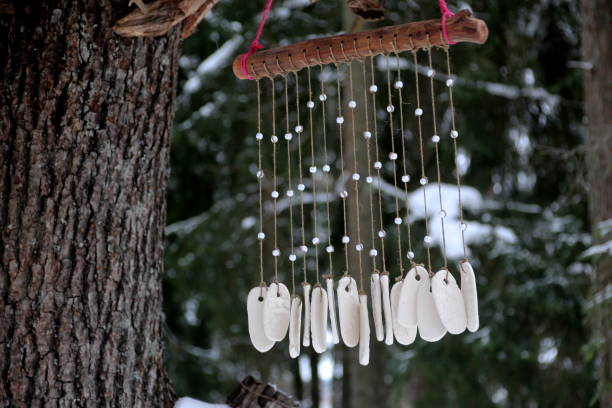 istock Hand made wind chimes hanging on a string with depth of field effect 1302794262