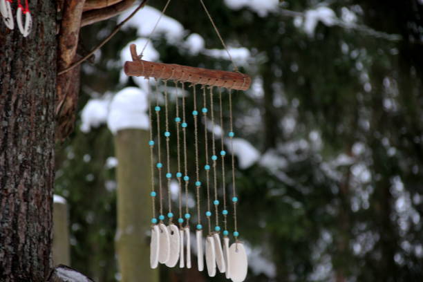 istock Hand made wind chimes hanging on a string with depth of field effect 1302794291