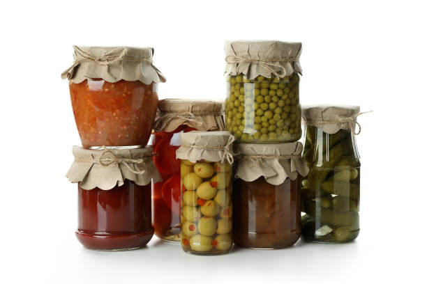 istock Jars with different canned food isolated on white background 1302795112