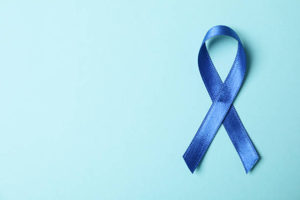 istock Blue awareness ribbon on light blue background, space for text 1302795899