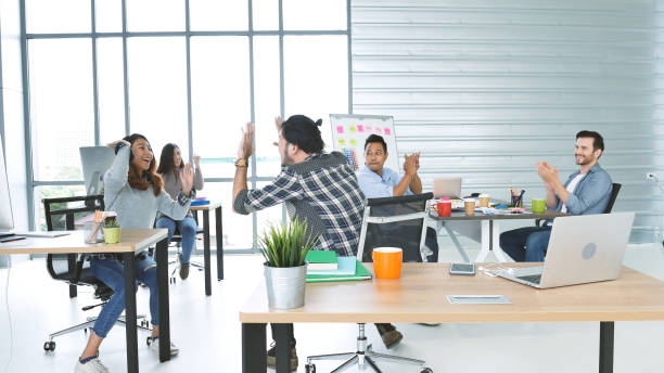 istock Office teamwork celebration working happiness Happy business people dance expression together at office after job done complete in meeting room. Diversity people happy moment dance together in company 1302797052