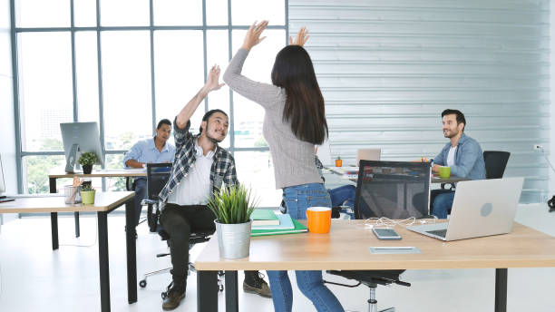 istock Office teamwork celebration working happiness Happy business people dance expression together at office after job done complete in meeting room. Diversity people happy moment dance together in company 1302797086