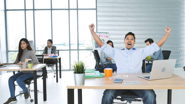 istock Office teamwork celebration working happiness Happy business people dance expression together at office after job done complete in meeting room. Diversity people happy moment dance together in company 1302797114