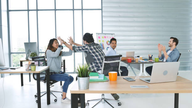 istock Office teamwork celebration working happiness Happy business people dance expression together at office after job done complete in meeting room. Diversity people happy moment dance together in company 1302797130
