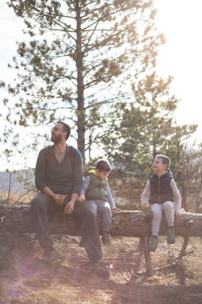istock A man and his sons hiking and exploring the forest. 1302798568