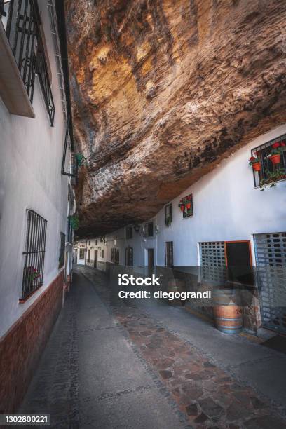 Houses Built Into Rocks At Cuevas De La Sombra Street Setenil De Las Bodegas Cadiz Province Andalusia Spain Stock Photo - Download Image Now