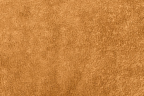 istock Background made of orange microfiber fabric 1302800326