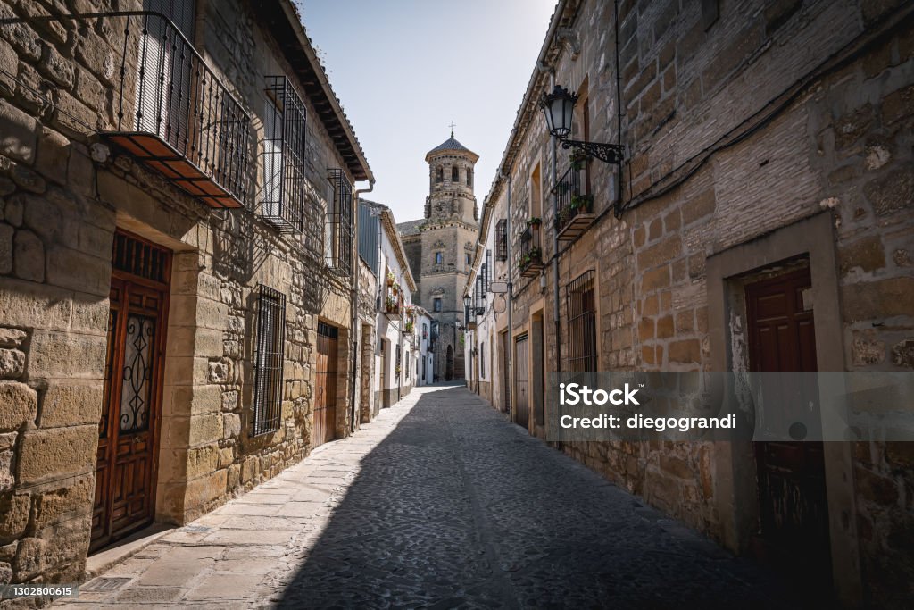 Medieval street of Baeza with old University Tower - Baeza, Jaen Province, Andalusia, Spain Baeza - Spain Stock Photo