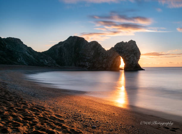 Durdle By sunrise Durdle door sunrise durdle door stock pictures, royalty-free photos & images