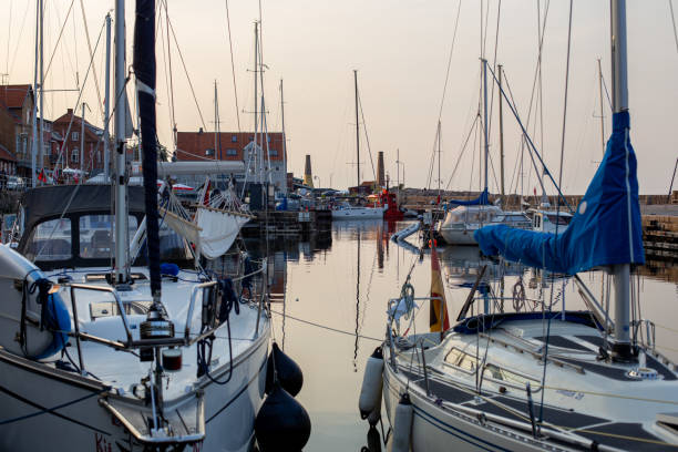 Bornholm, Denmark - August 6, 2020: Sailboats anchored at the small harbor in Allinge