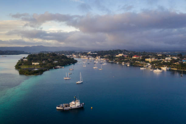 Nightfall over the Port Vila harbor with sailboat and other yachts in Vanuatu capital city stock photo