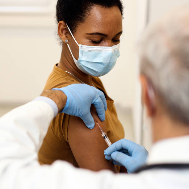 istock African woman on a vaccination 1302802561