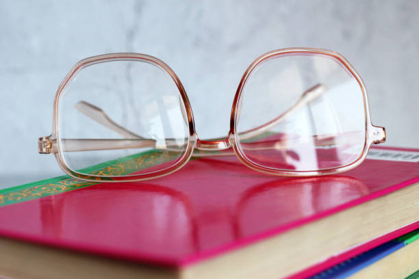 istock old books and glasses. vintage style 1302803381