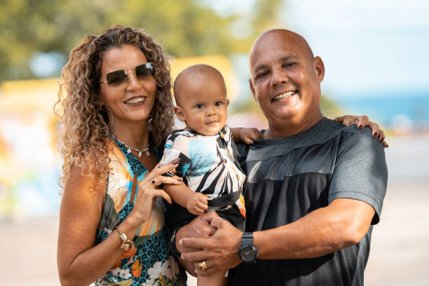 istock Father and mother holding baby son 1302808627