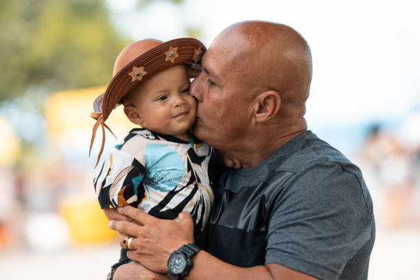 Unconditional love Love, Father, Baby, Embracing, Street, Olinda Pernambuco father son grandfather fathers day stock pictures, royalty-free photos & images