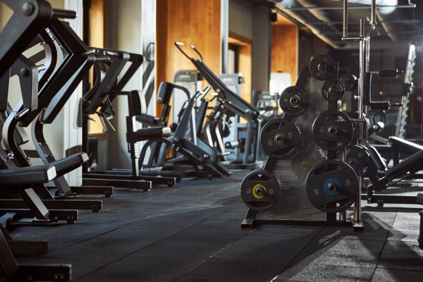 istock Well-equipped gym with machines for physical exercises 1302809371