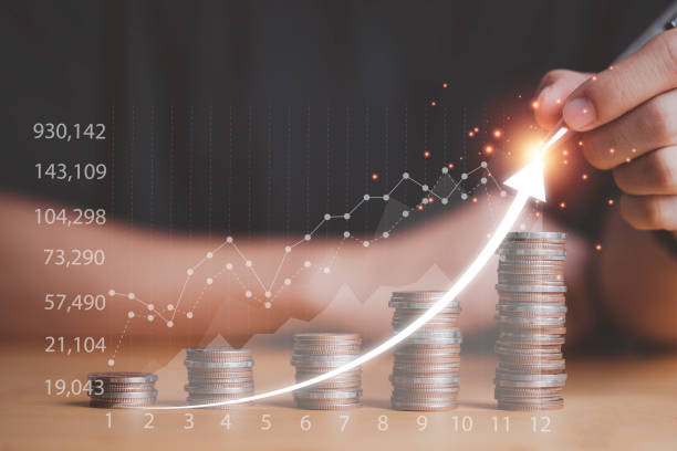 istock Businessman drawing increasing arrow on coins stacking growth with virtual graph and chart , deposit money saving and business profit growth concept. 1302809383