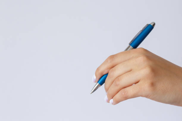 istock Gesture and sign, hand holding a pen on a white background 1302810754