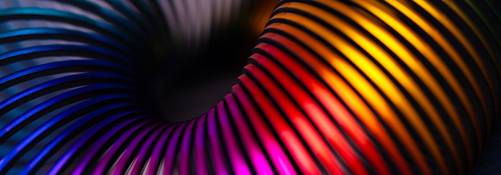 Multicolored retro toy spiral, panoramic image