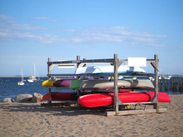 istock Image of kayaks stored on the beach. 1302812162