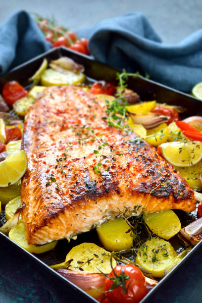 istock Baked salmon fillet with vegetables 1302813886