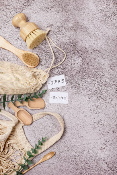 istock Zero Waste Eco Friendly Concept Background with Bathroom and Kitchen Accessories and Eco Bag on Concrete Background Vertical Copy 1302814882