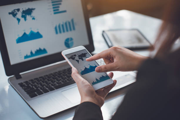 istock businessman working on project for analyzing company financial report balance statement with documents graphics at modern office space. Concept picture of business,economy, market,money and tax. 1302814962