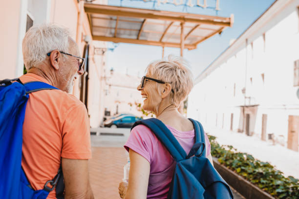 istock Senior couple with backpack travelling 1302816098