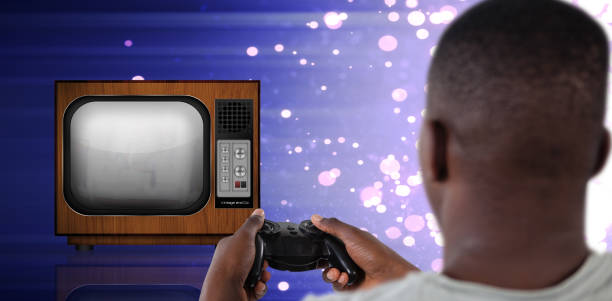 Close-up of boys hands holding a retro video game controllers, sitting on the carpeted floor and deeply engaged in vintage gameplay