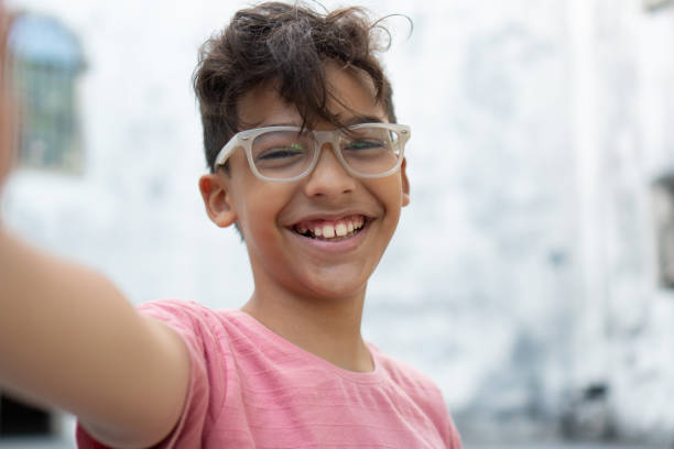 istock Boy taking a selfie outdoors 1302818365