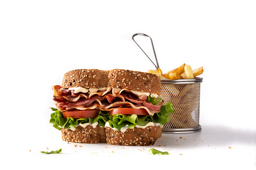 BLT sandwich and fries isolated on white background