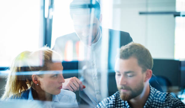 istock Business colleagues working in the office and brainstorming 1302822033