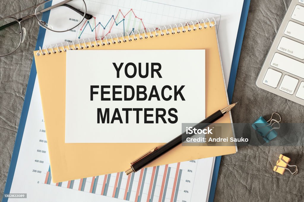 YOUR FEEDBACK MATTERS is written in a document on the office desk YOUR FEEDBACK MATTERS is written in a document on the office desk with office accessories. Feedback Stock Photo