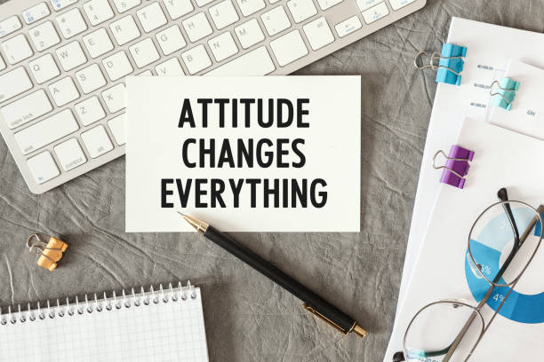Attitude Changes Everything is written in a document on the office desk stock photo