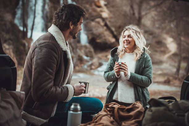 istock Couple hikers drinking tea in nature 1302822310