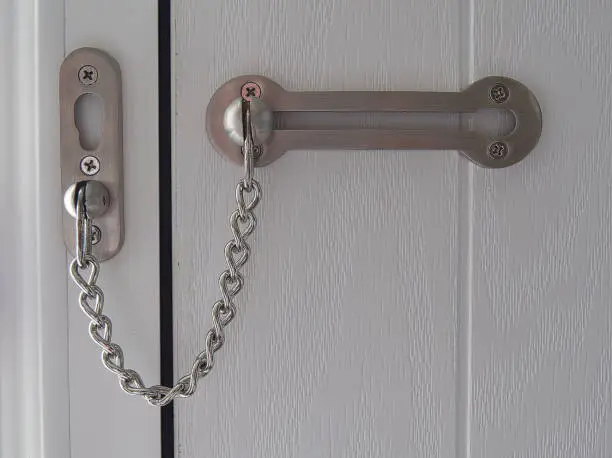 Photo of Door security chain on domestic door, North Yorkshire, England, Britain, February 2021