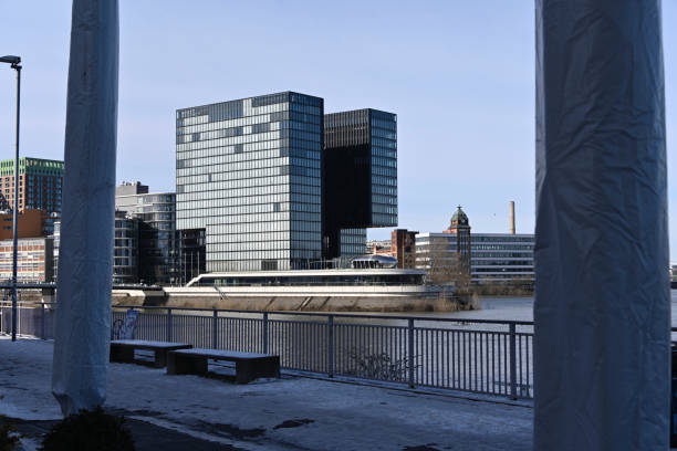 Duesseldorf, Germany, February 14, 2021 - The Duesseldorf Media Harbour with the Hyatt Regency Hotel on the right side and diverse Office Buildings on the left side.