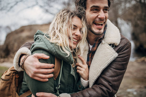 istock Happy couple exploring nature together 1302826715
