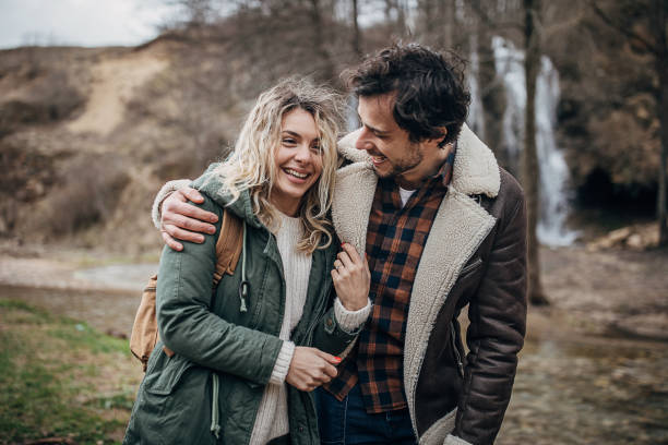 istock Couple hikers exploring nature together 1302827888
