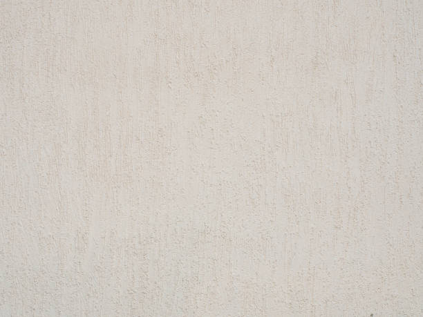 istock Light beige wall with decorative textured plaster. Not seamless texture 1302828156