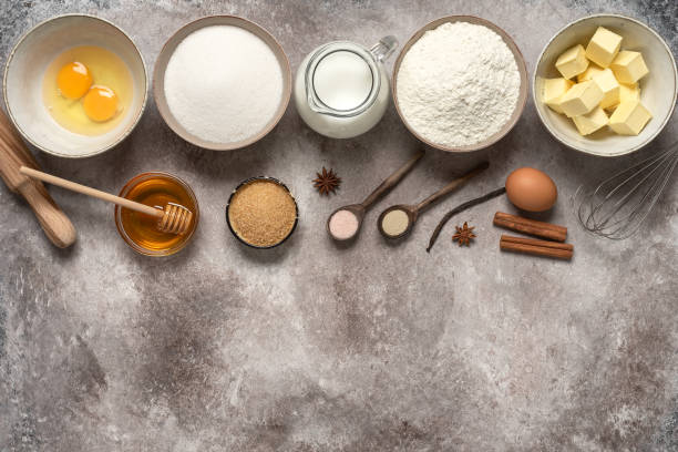 istock Baking background. Baking ingredients: flour, eggs, sugar, butter, milk and spices. Top view. 1302830529
