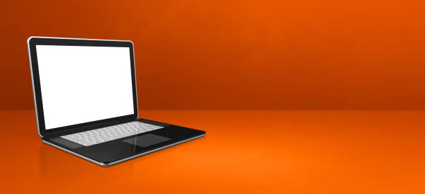 istock Laptop computer on orange office scene background banner 1302830779